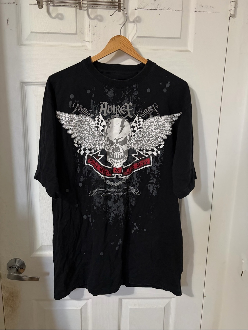 Avirex Black Tee with White Winged Skull and Red Banner